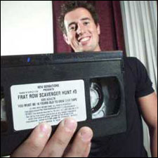 ASU student Brian Buck, holding porn videotape in foreground