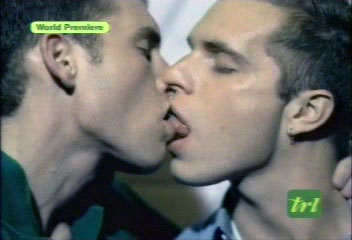 still of one guy with tongue in another guy's mouth from Christina Aguilera video 'Beautiful'